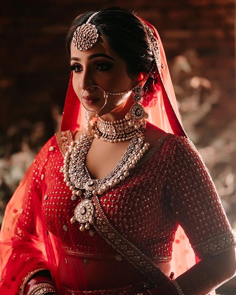 Close-up bridal jewelry portrait in red